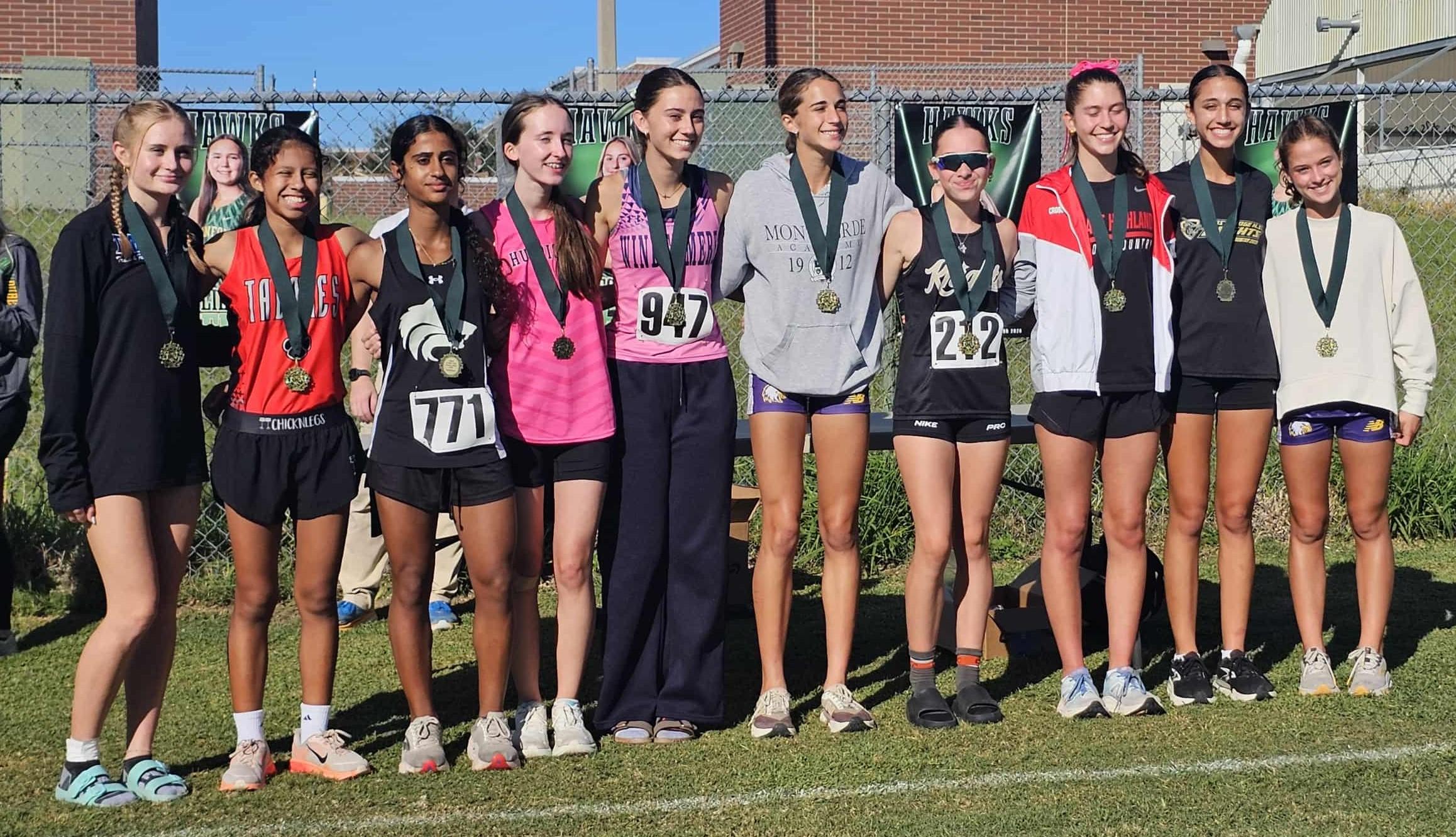 Hortance Sallault and Jessie Volz in the medal line at Hawks Last Chance