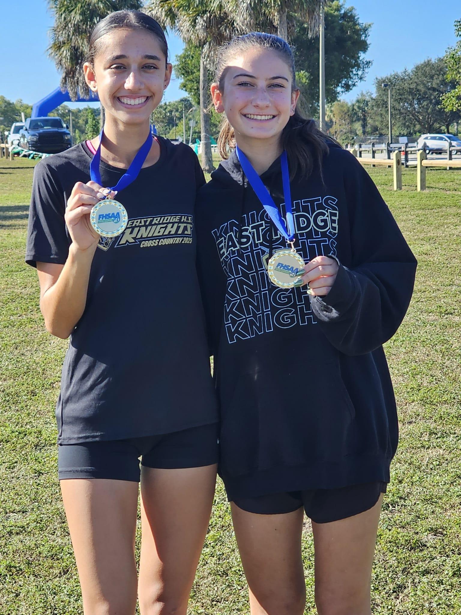 Rhyen Foley and Jessie Volz show off their regional medals at Boca